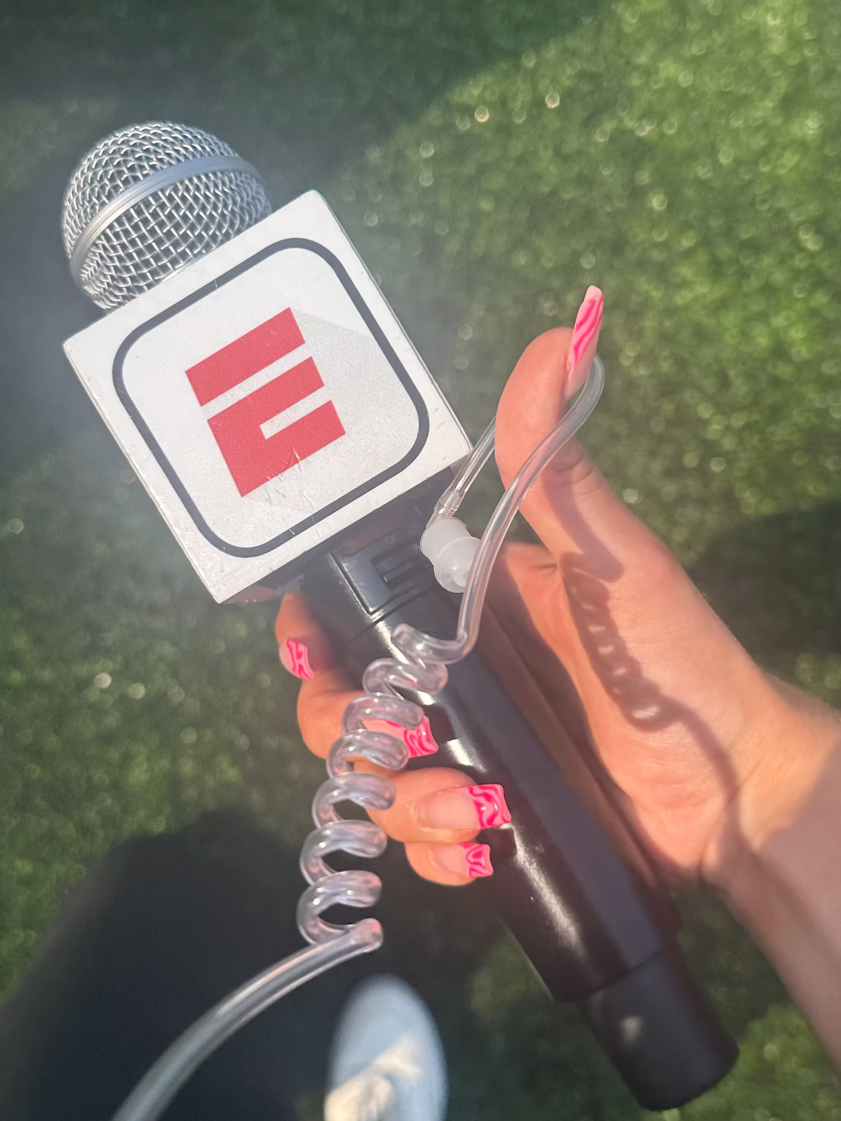 Ava holding an ESPN microphone while reporting
